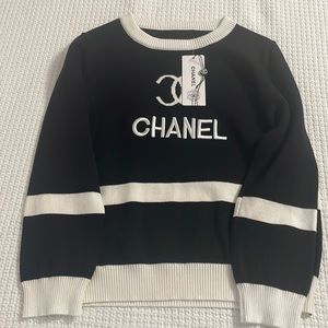 Chanel white and black sweater.